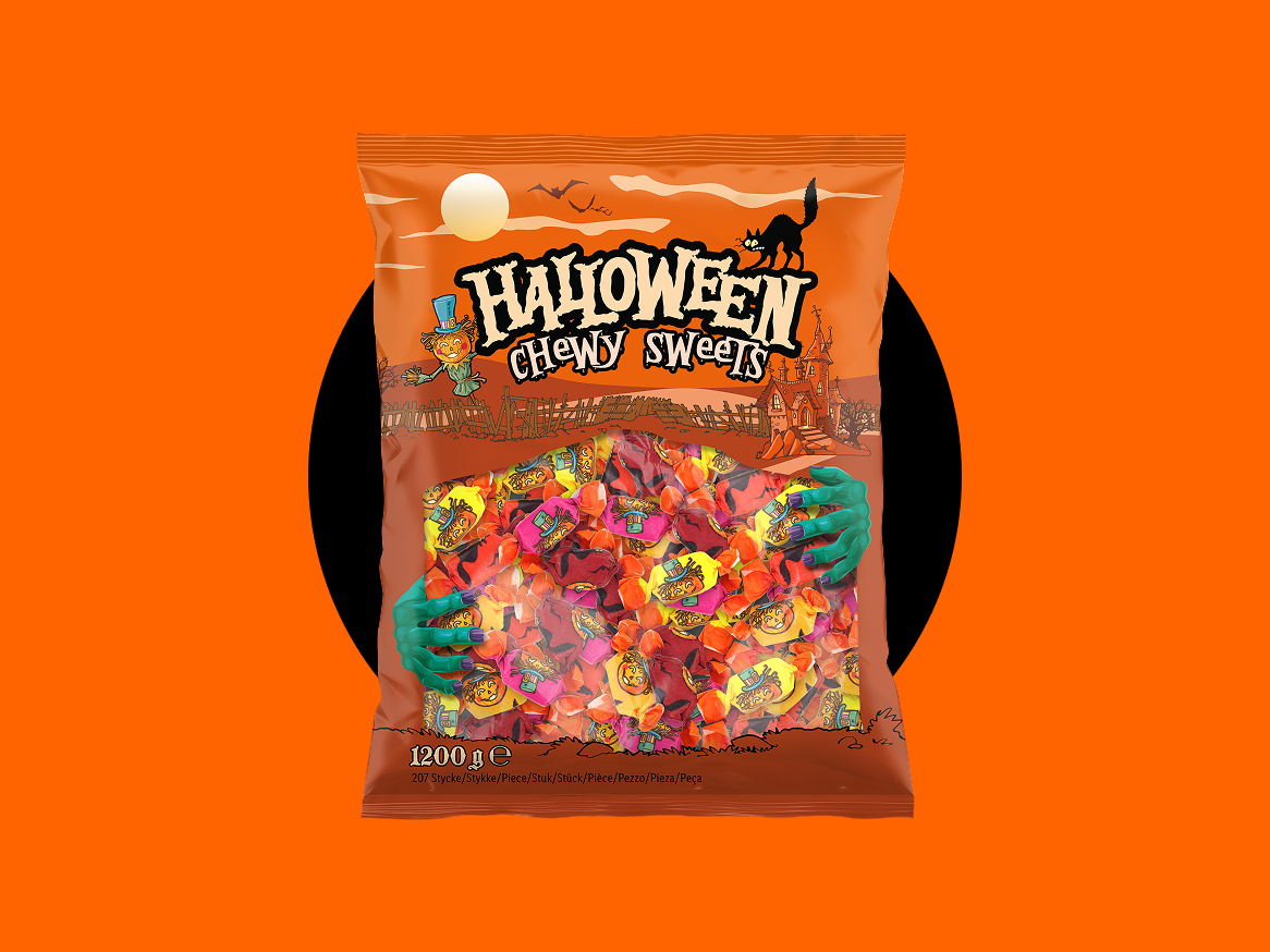 Saco de doces mastigáveis de Halloween com tema de abóbora e casa assombrada.